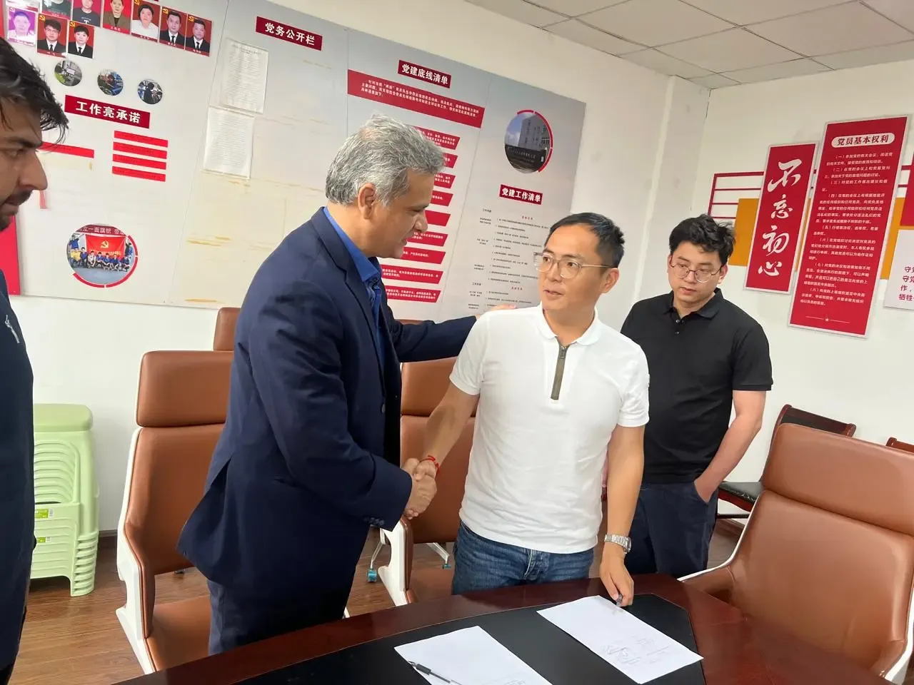 Aventine meeting and shaking hands with a manufacturing partner