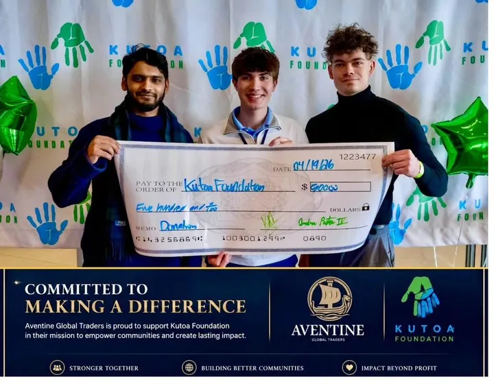 Aventine Global Traders co-founders presenting a $500 donation check to the Kutoa Foundation