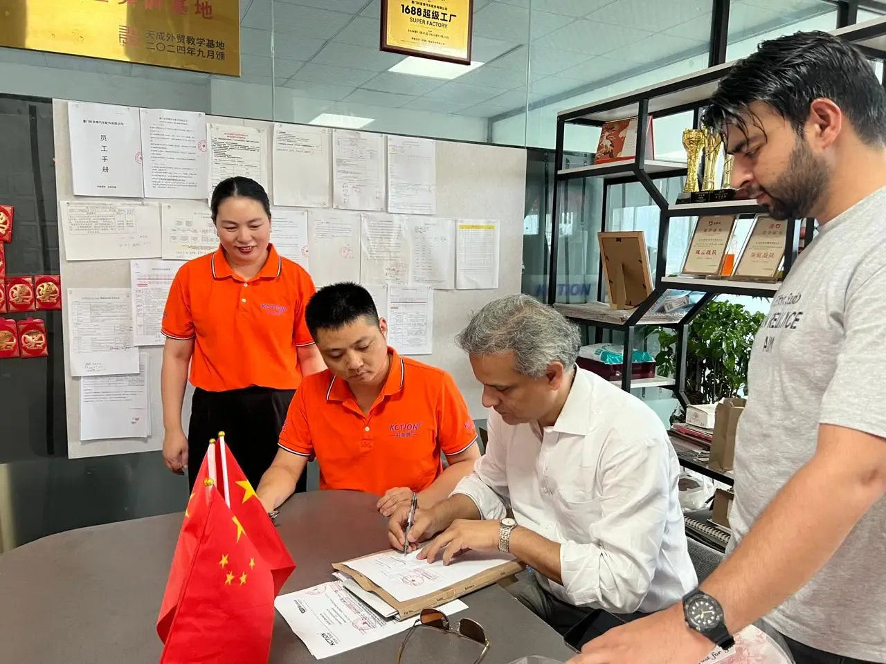Finalizing a partnership at a supplier's factory